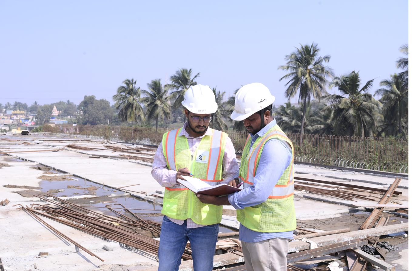 Engineers reviewing drawings on the bridge deck